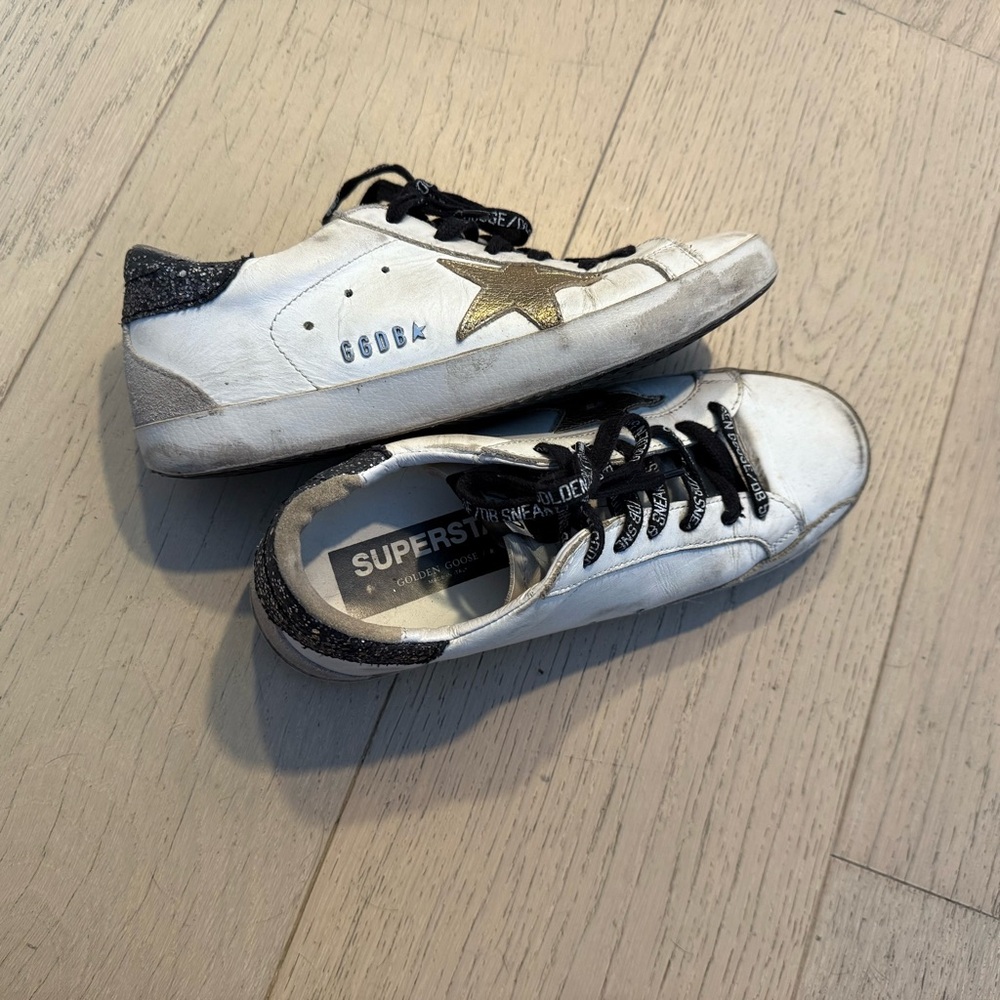 Golden Goose Super-Star White Sneakers with Gold Star and Black Accents